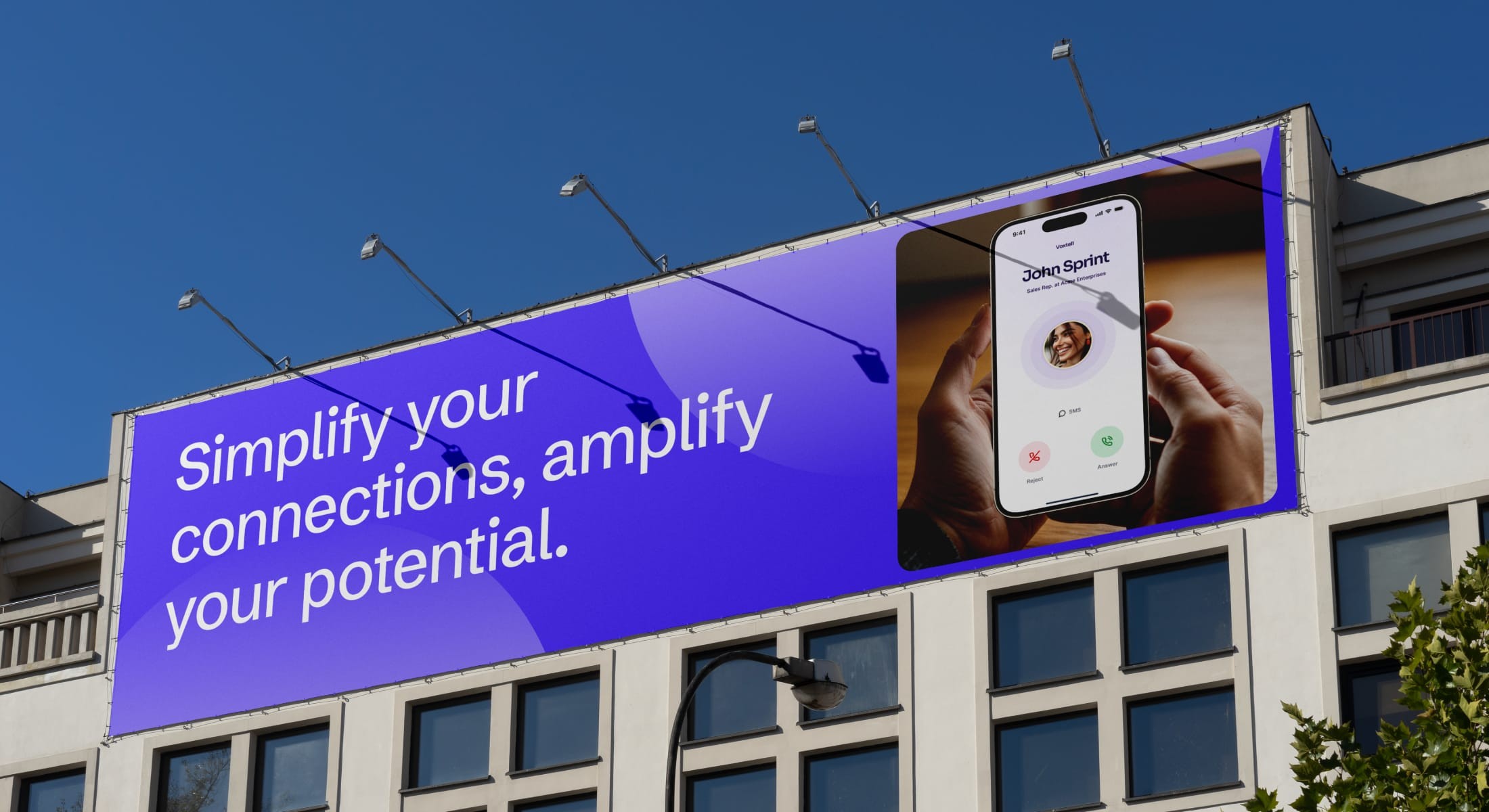 “Simplify your connections, amplify your potential” billboard on a city building