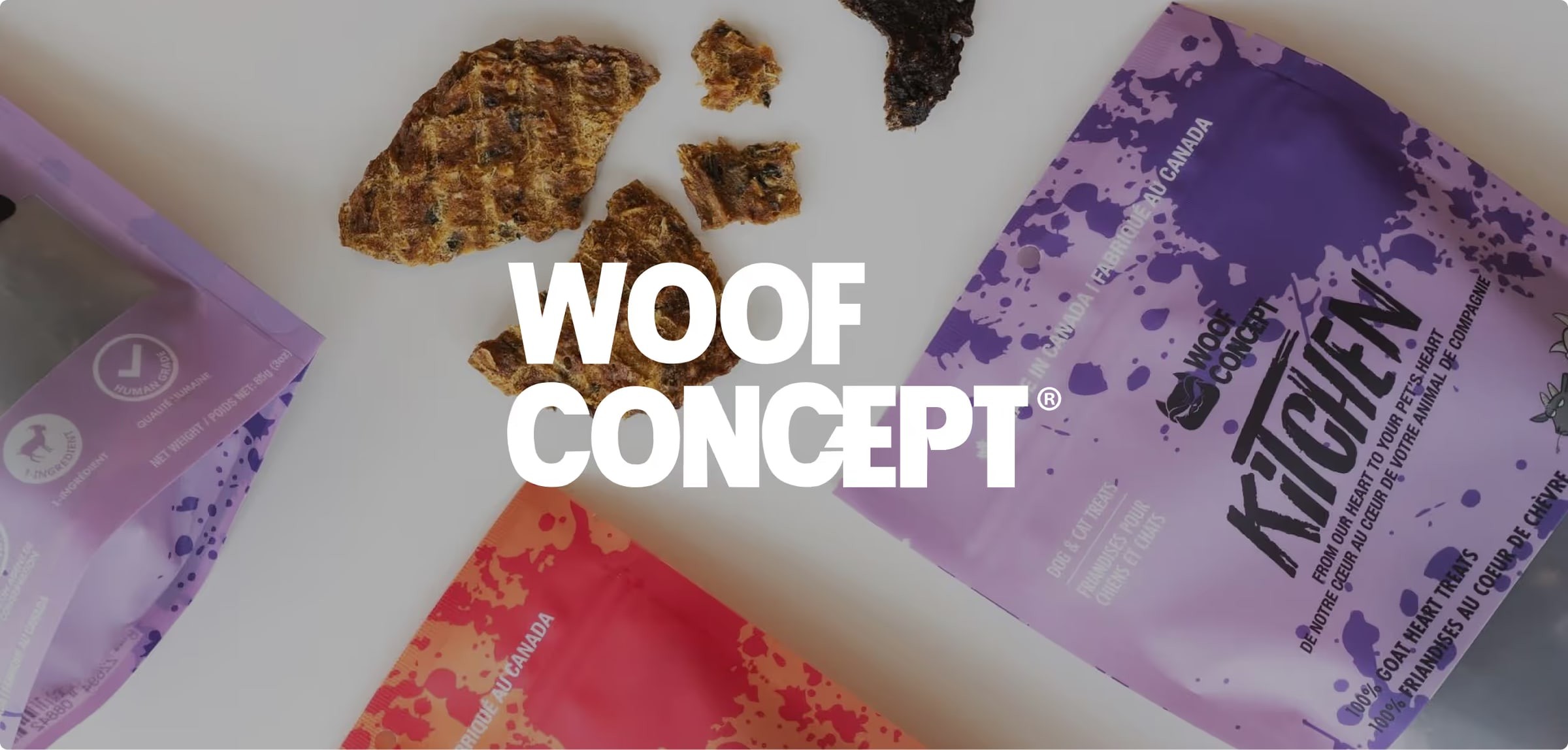 The Woof Concept logo over Woof Kitchen treat bags