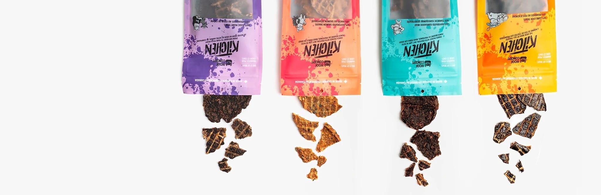 A row of Woof Kitchen bags with treats spilling out